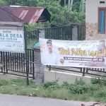 SPANDUK ADIK MANTAN BUPATI MAJU PILKADA TERPAMPANG DI KANTOR DESA, LMPP PALUTA PERTANYAKAN NETRALITAS PJ BUPATI DAN KEPALA DESA